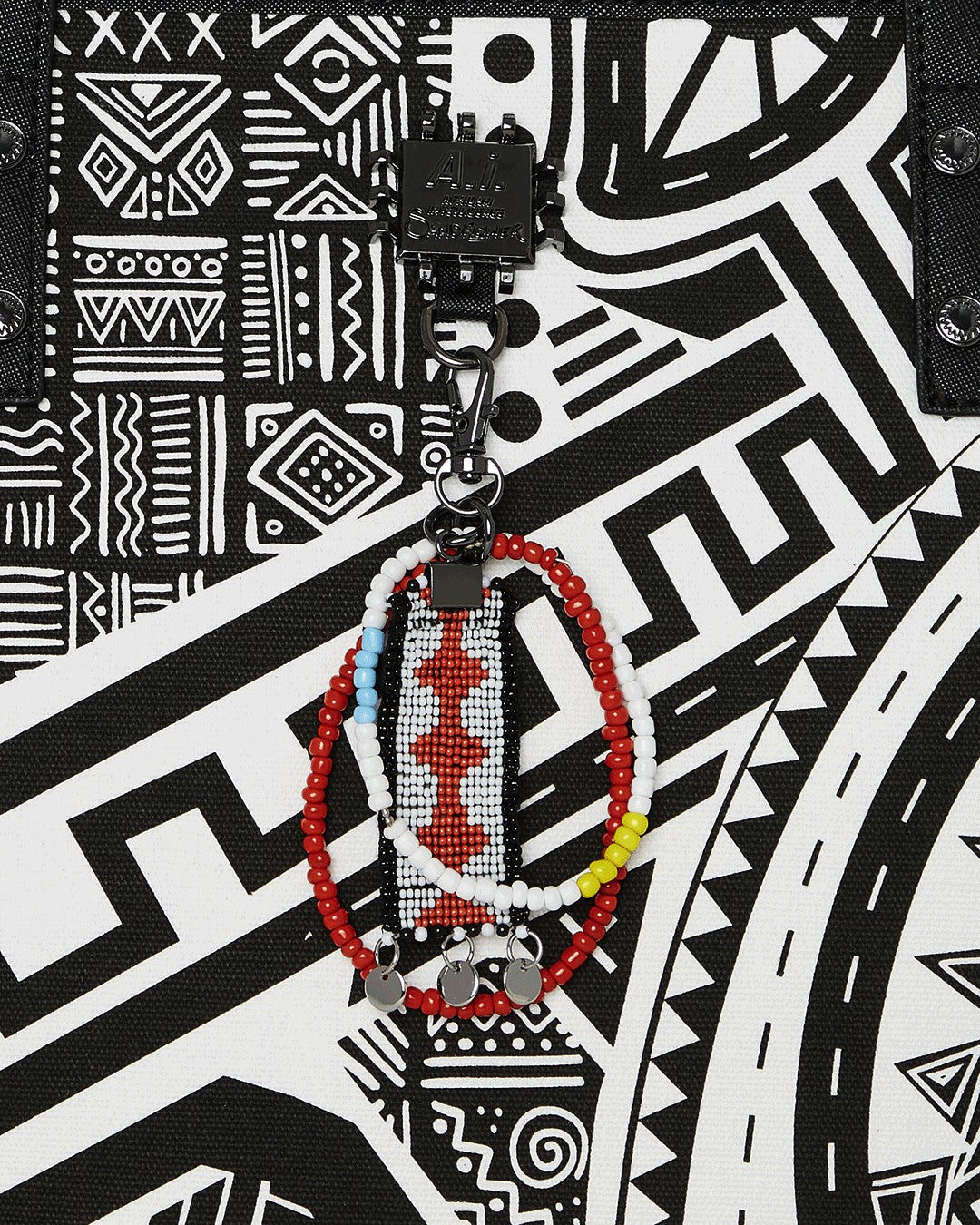 Sprayground A.I. AFRICAN INTELLIGENCE THE SKYHAWK WING TOTE - SANDFLOWER COLLAB