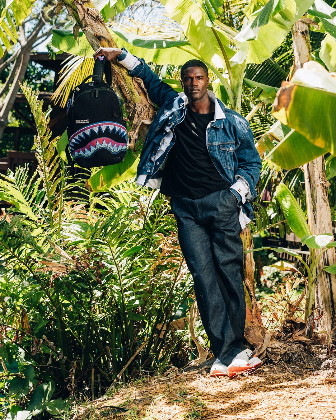 Sprayground A.I. AFRICAN INTELLIGENCE BORN AND RAISED BACKPACK - SANDFLOWER COLLAB