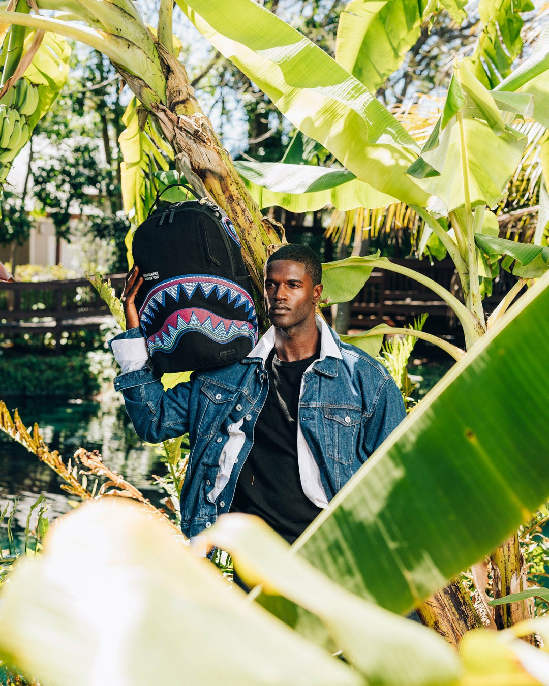 Sprayground A.I. AFRICAN INTELLIGENCE BORN AND RAISED BACKPACK - SANDFLOWER COLLAB