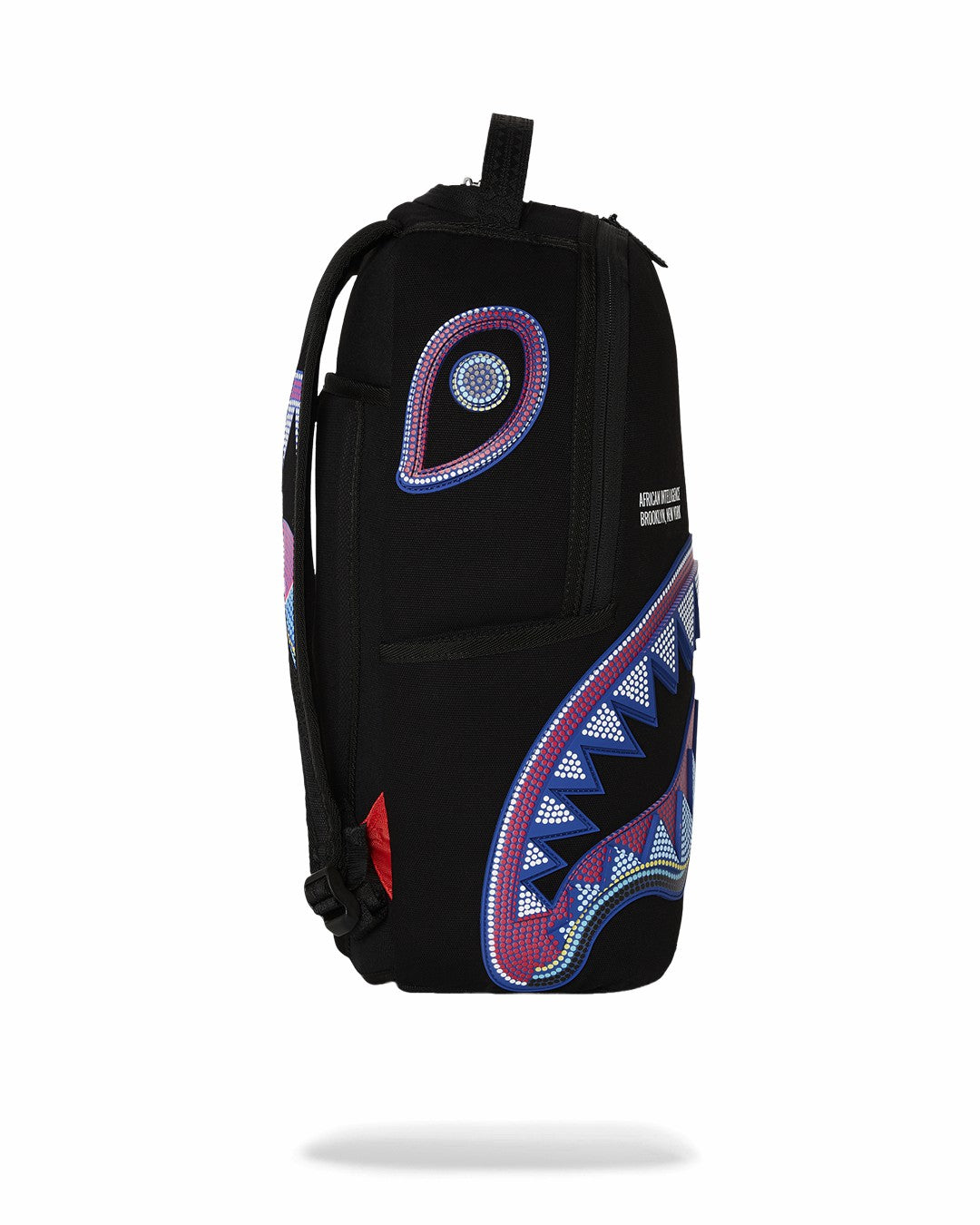 Sprayground A.I. AFRICAN INTELLIGENCE BORN AND RAISED BACKPACK - SANDFLOWER COLLAB